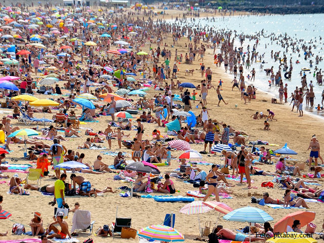 Crowds take to the seaside and mountain resorts